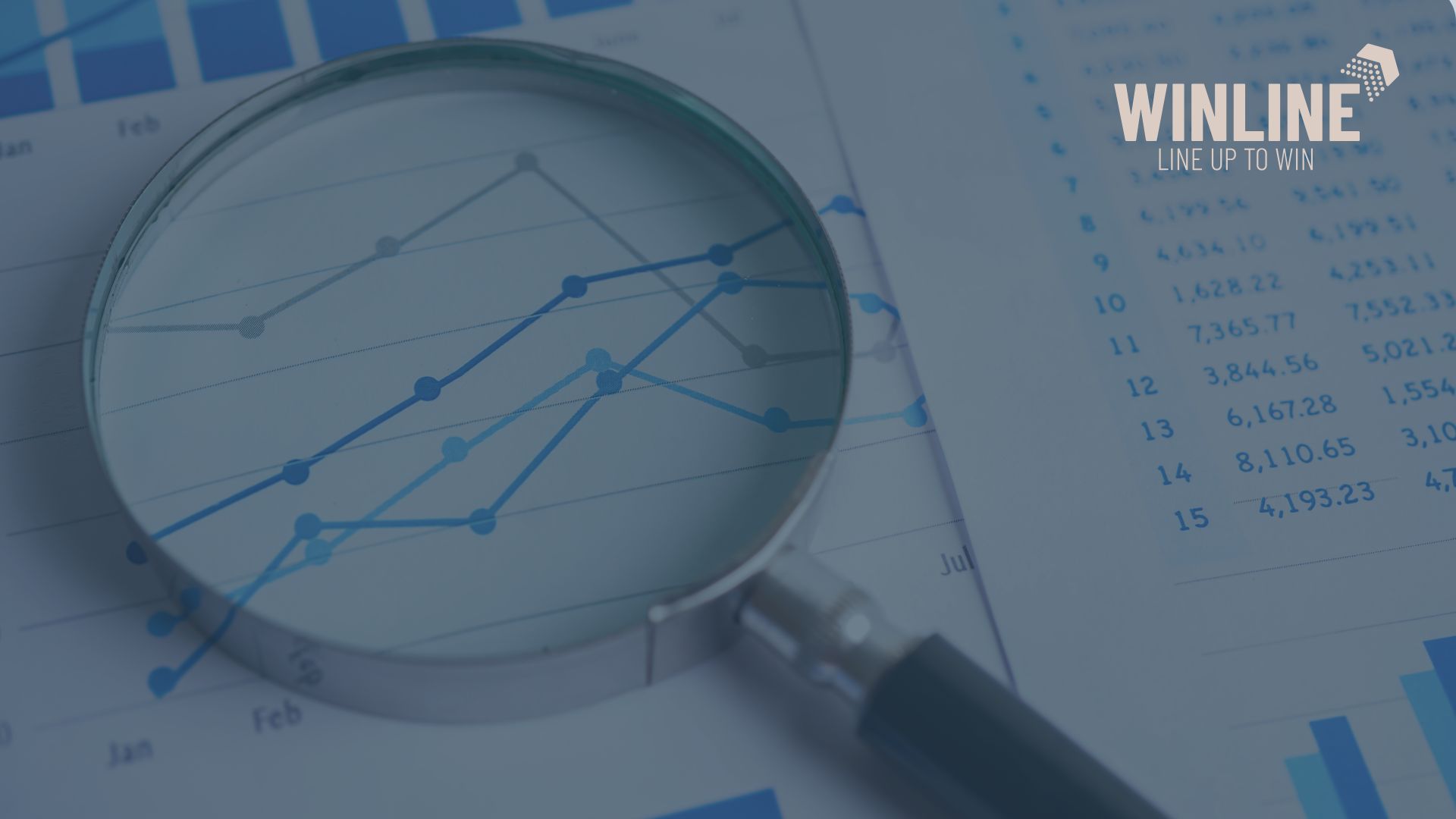 Audyt marketingowy – lupa nad wykresem wzrostu i danymi finansowymi, logo WINLINE